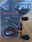 Lews Xfinity Baitcast Reel 8 Bearing System 7.5:1 Right Hand Clam Pack. Fixed Price $49.33.