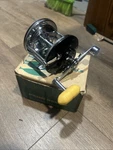 Vintage Penn 65 Long Beach Star Drag Fishing Reel Box Yellow Handle. Fixed Price $59.00.
