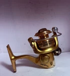 Bass Pro Tiny Lite Ultra Light Spinning Reel- Very Nice. Fixed Price $7.99.