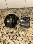 Shimano Curado CU201E7 Baitcast Reel - Green. Fixed Price $250.00.