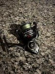Quantum Smoke SL25 Spinning Reel Missing Handle. Fixed Price $110.00.