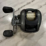 Preowned Bass Pro Shops MC-1 Megacast Baitcasting Fishing Reel 6.2:1 Gear Ratio. Fixed Price $30.00.