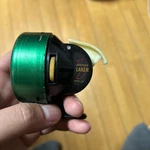 Johnson Laker Model 140 Spincast Reel With White Handle. Fixed Price $142.99.
