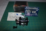 Abu Garcia Ambassadeur 5000C Baitcasting Fishing Reel W/ Box, Papers, Oil Wrench. Fixed Price $125.00.