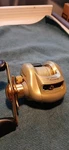 Gold Pflueger 6.3:1 Right Hand Baitcasting Reel Pfltrionlp. Fixed Price $45.00.