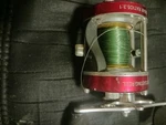 Kastking Rover Right-haanded Baitcast Fishing Reel Red. Fixed Price $200.00.