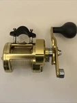 Shimano Trinidad TN14 Gold Fishing Reel Right Hand With Line. Fixed Price $350.00.