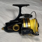 Penn 9500SS Vintage Spinning Fishing Reel Black & Gold Spooled With 30# Braid. Fixed Price $110.00.