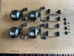 4 Shimano Curado Bantam Reels CU-100B X 3 & CU-200BSF + Original Handles. Fixed Price $275.00.