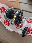 Penn Squidder Jr 146L New Nib, Clamp, Manual, Box. Fixed Price $160.00.