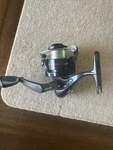 Shakespeare Ugly 025 Black Spinning Reel. Fixed Price $13.00.