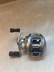 Bass Pro Shop PQX10HLA High Speed Dbs Bait Cast Reel. Fixed Price $100.00.