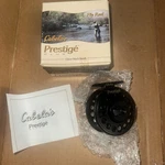 New Cabelas Prestige Plus (1) Fly Fishing Reel With Original Box. Fixed Price $73.75.