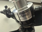 Shakespeare Alpha Xt 200 Spinning Fishing Reel, Used With Alluminum Spool. Fixed Price $10.77.