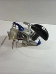 Shakespeare Surf And Pier SP50A Silver Blue Spinning Reel. Fixed Price $30.00.