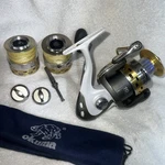 Okuma Vsystem V-55A Spinning Reel With 1 Spare Spool , And Cover. Fixed Price $160.00.