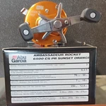 Abu Garcia Ambassadeur Rocket 6500 Cs Pr Orange Baitcast Reel 6.3:1 Rh. Fixed Price $275.00.