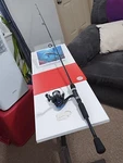 Spinning Fishing Rod Shakespeare Ardent 6'6" Med 4-12LB And Reel Conquest. Fixed Price $45.00.