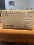 Shimano Calcutta 400 Fishing Reel Gold Aluminum Box Guide Tool Parts. Fixed Price $320.00.