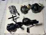 5 Vintage Fishing Reels 2 Mitchell Johnson 1 Phlueger See Description For Mod. Fixed Price $45.00.