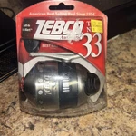 Zebco 33 Spincast Fishing Reel,quickset Anti-reverse W/ Bite Alert; Silver/black. Fixed Price $25.00.