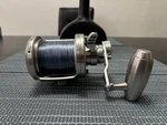 Preowned Daiwa Saltiga LD50 2 Speed Reel With Monofilament Line Included. Fixed Price $575.00.