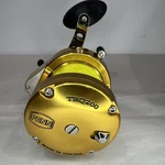 Penn Trq 200 Torque Gold Big Game Fishing Reel W/ Rod Clamp. Fixed Price $369.99.