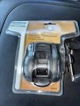 New Plastic Shakespeare Axiom AX510 4 Bearing Bait Cast Reel. Fixed Price $25.00.