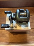 Shimano Bantam Curado CU-200 B5:1 Baitcast Reel Right Handed Box & Paperwork. Fixed Price $125.00.