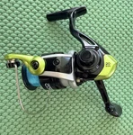 Zebco Stinger Spinning Fishing Reel, 1+1 Bearings, Size 20, Silver/green. Fixed Price $14.95.