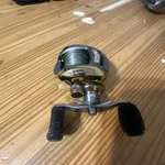 Bass Pro Shops Johnny Morris Gold Series Baitcast Reel 11BB 6.4:1 JMG10HA. Fixed Price $70.00.