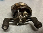 Bass Pro Shops Johnny Morris Signature Series Baitcast Reel - Left 6.4:1 11BB. Fixed Price $65.00.
